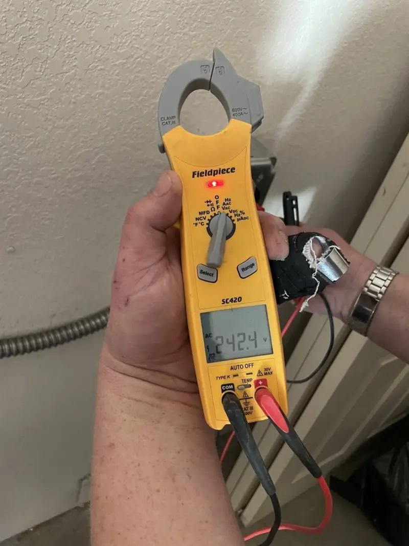 Voltage testing with clamp meter during Ceiling Fan Installation in Edgemoor